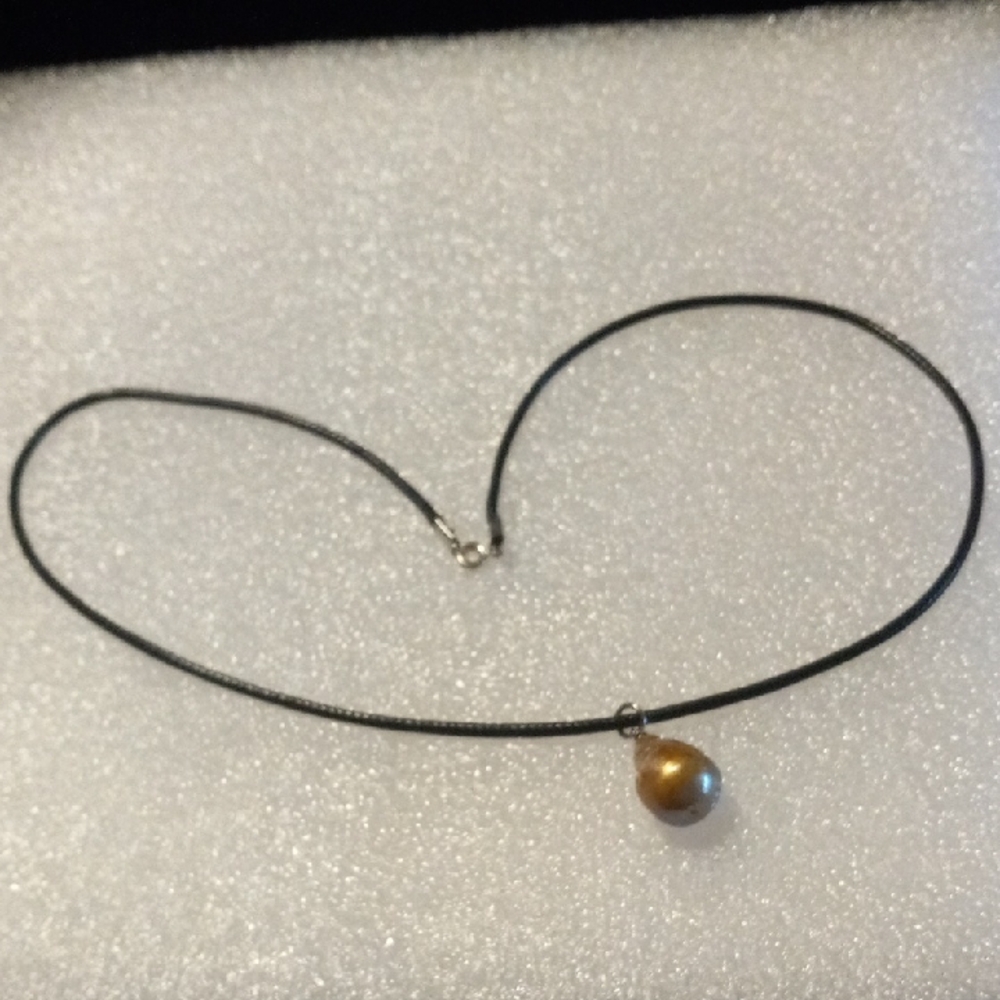 Elegant Black Necklace with a natural  Gold Pearl Pendant